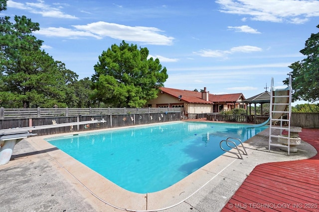 17331 S 174th Ave E, Bixby, OK 74008 - view of pool featuring a water slide and a fenced backyard
