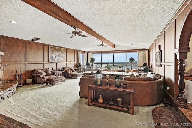 17331 S 174th Ave E, Bixby, OK 74008 - carpeted living area featuring a textured ceiling, ceiling fan, a decorative wall, and recessed lighting