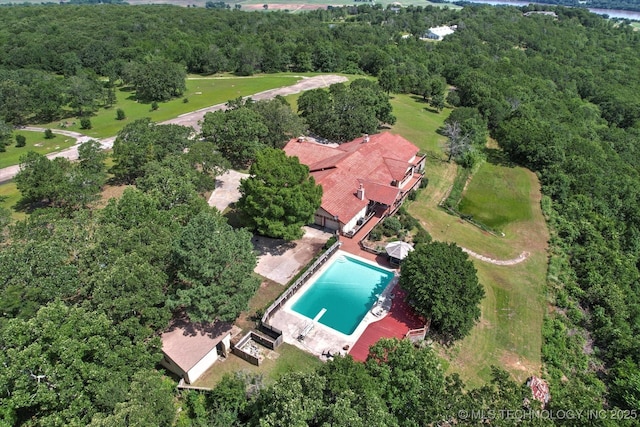 17331 S 174th Ave E, Bixby, OK 74008 - drone / aerial view of a pool area and a heavily wooded area