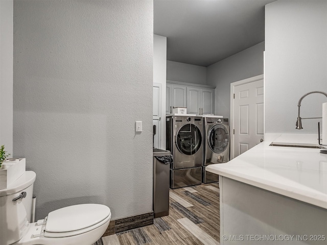 353800 E 5400th Rd, Maramec Twp, OK 74045 - laundry room featuring washing machine and clothes dryer and wood finished floors