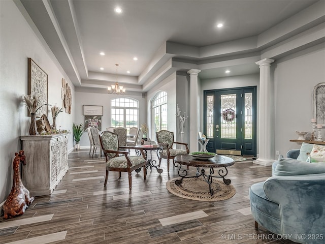 353800 E 5400th Rd, Maramec Twp, OK 74045 - living area with decorative columns, a tray ceiling, recessed lighting, wood finished floors, and a chandelier