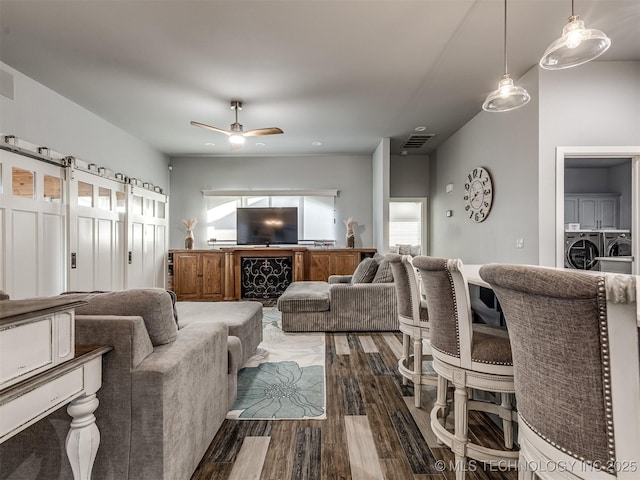 353800 E 5400th Rd, Maramec Twp, OK 74045 - living room with independent washer and dryer, dark wood-style floors, and a ceiling fan