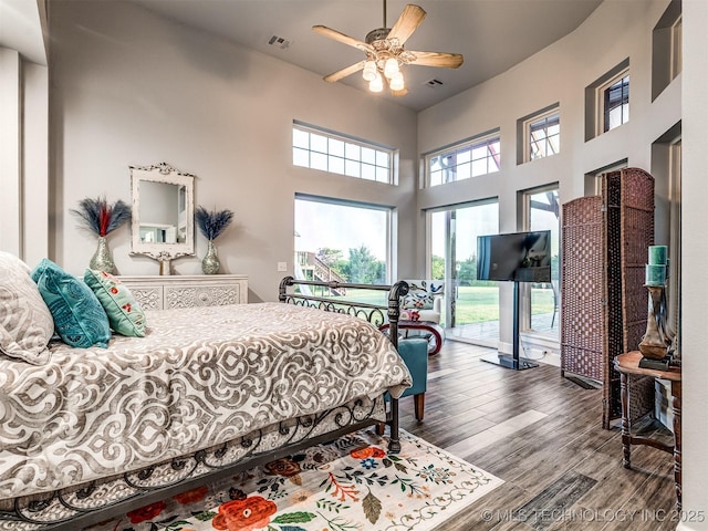 353800 E 5400th Rd, Maramec Twp, OK 74045 - bedroom featuring wood finished floors, access to outside, a ceiling fan, and a high ceiling