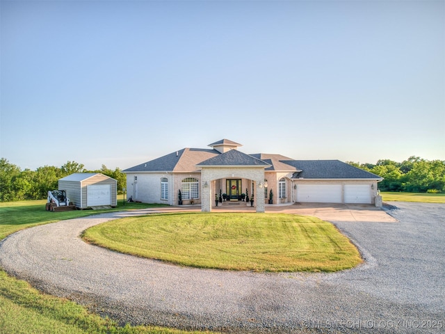 353800 E 5400th Rd, Maramec Twp, OK 74045 - french country home featuring driveway, a front lawn, a garage, a shingled roof, and brick siding