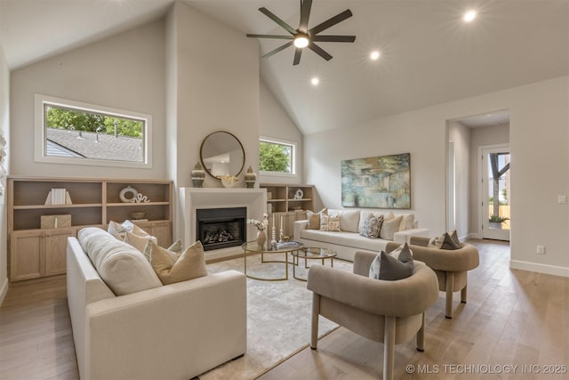 3528 S Troost Ave, Tulsa, OK 74105 - living area featuring a ceiling fan, plenty of natural light, high vaulted ceiling, a fireplace, and light wood finished floors