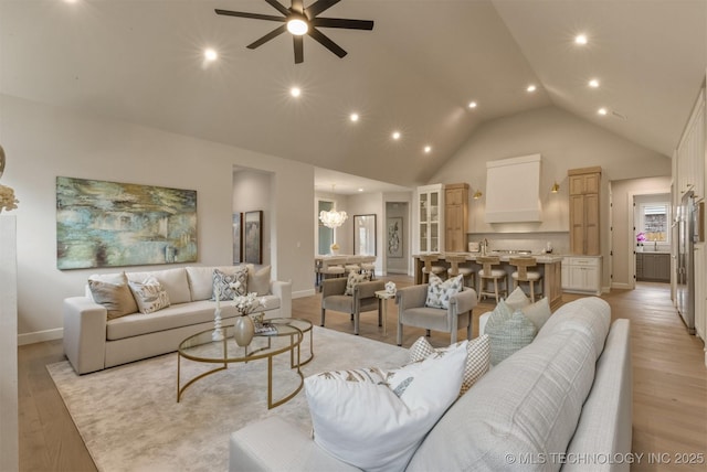3528 S Troost Ave, Tulsa, OK 74105 - living room featuring ceiling fan, light wood-style flooring, recessed lighting, a chandelier, and high vaulted ceiling