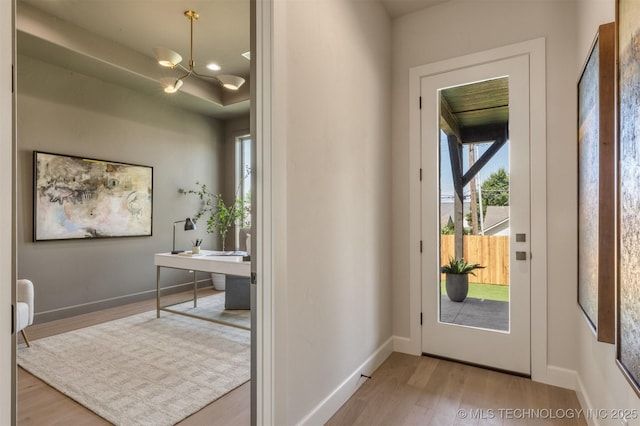 3528 S Troost Ave, Tulsa, OK 74105 - entrance foyer with wood finished floors and a chandelier