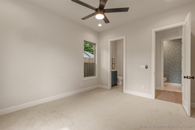 3528 S Troost Ave, Tulsa, OK 74105 - unfurnished bedroom with light colored carpet, ensuite bath, recessed lighting, and ceiling fan
