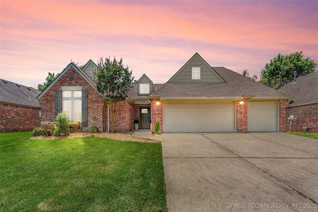 11936 S 98th E Ave, Bixby, OK 74008 - traditional-style home featuring an attached garage, driveway, a front yard, brick siding, and a shingled roof