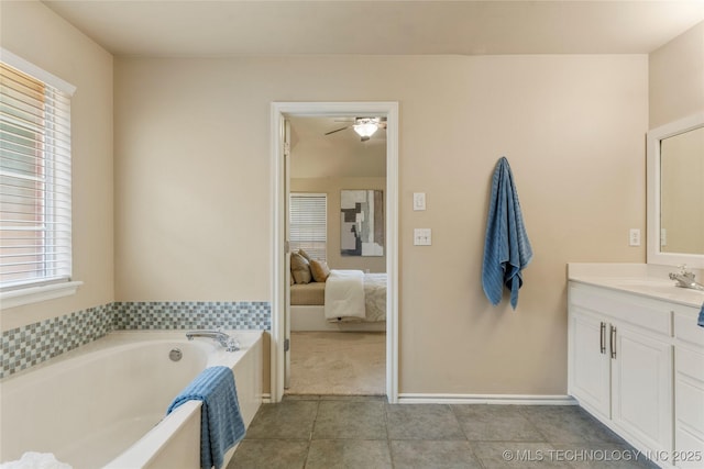 11936 S 98th E Ave, Bixby, OK 74008 - ensuite bathroom with vanity, a bath, tile patterned floors, and plenty of natural light