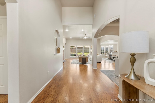 11936 S 98th E Ave, Bixby, OK 74008 - hallway with a towering ceiling, arched walkways, and wood finished floors