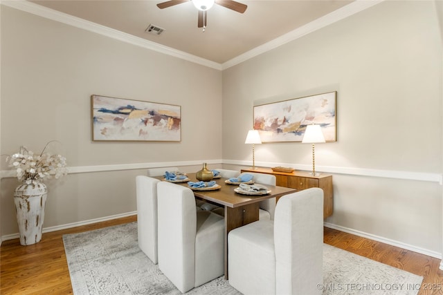 11936 S 98th E Ave, Bixby, OK 74008 - dining room with wood finished floors, ornamental molding, and ceiling fan