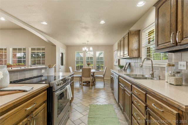 11936 S 98th E Ave, Bixby, OK 74008 - kitchen featuring stainless steel electric stove, decorative backsplash, dishwasher, a chandelier, and recessed lighting