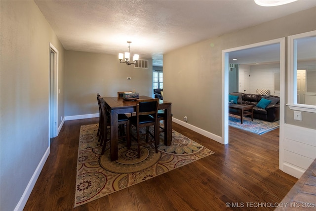809 W Imperial St, Broken Arrow, OK 74011 - dining area with wood finished floors and a chandelier