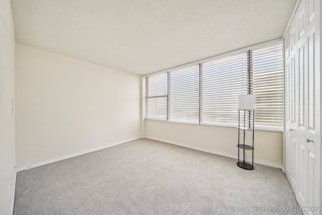 450 W 7th St # 908, Tulsa, OK 74119 - carpeted spare room featuring baseboards