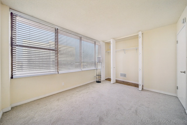 450 W 7th St # 908, Tulsa, OK 74119 - unfurnished bedroom featuring carpet floors and baseboards