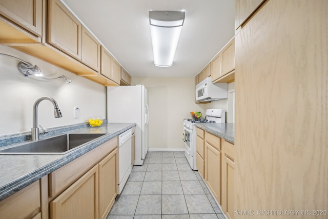 450 W 7th St # 908, Tulsa, OK 74119 - kitchen with white appliances, light brown cabinetry, light tile patterned floors, and dark countertops