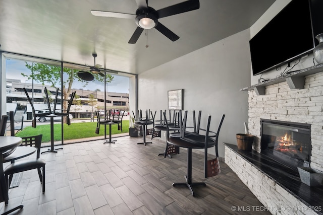 450 W 7th St # 908, Tulsa, OK 74119 - interior space featuring a stone fireplace and ceiling fan