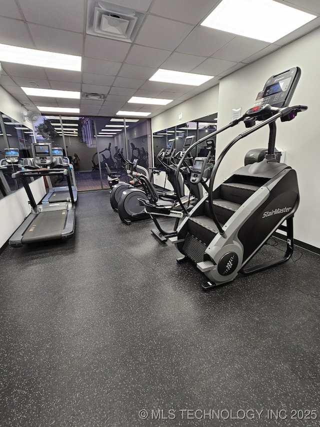 450 W 7th St # 908, Tulsa, OK 74119 - exercise room with a paneled ceiling and baseboards
