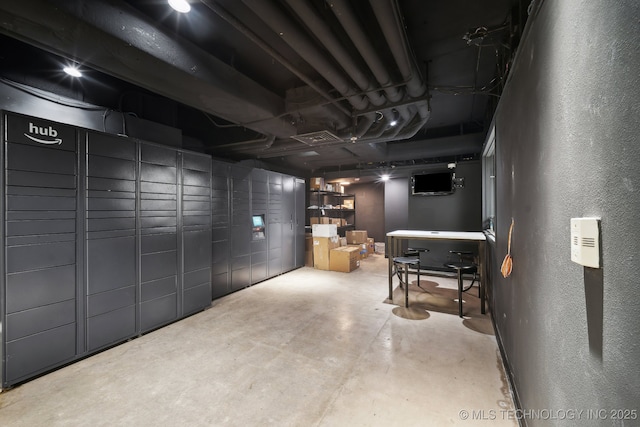 450 W 7th St # 908, Tulsa, OK 74119 - below grade area featuring a textured wall