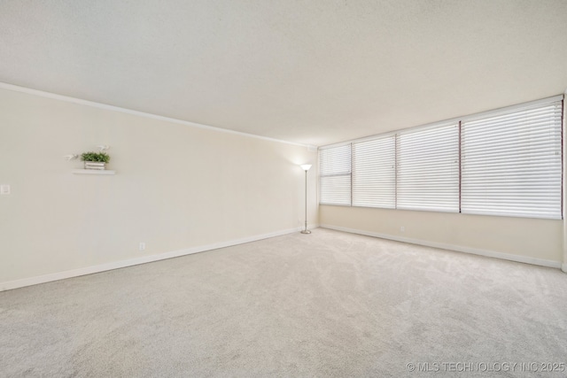 450 W 7th St # 908, Tulsa, OK 74119 - carpeted empty room with crown molding