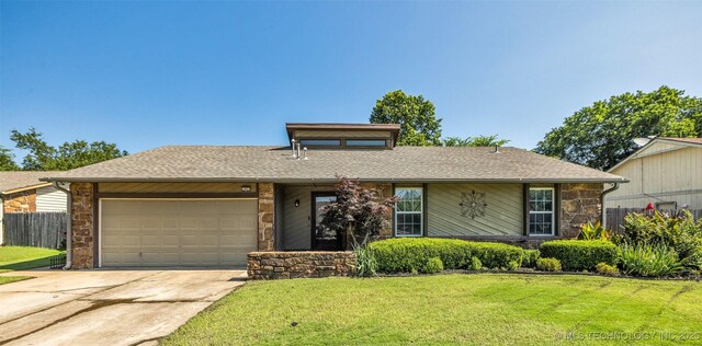 2847 W 115th Pl S, Jenks, OK 74037 - view of front facade with stone siding, a garage, concrete driveway, and a shingled roof