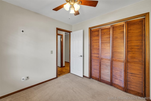 2847 W 115th Pl S, Jenks, OK 74037 - unfurnished bedroom featuring light colored carpet, a closet, and a ceiling fan