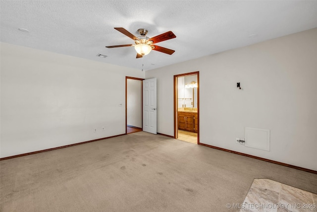 2847 W 115th Pl S, Jenks, OK 74037 - unfurnished bedroom featuring light colored carpet, ensuite bathroom, a textured ceiling, and ceiling fan