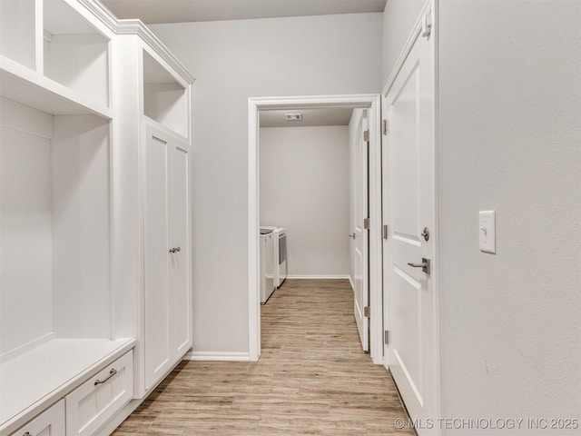 7809 S Redbud Ave, Broken Arrow, OK 74011 - mudroom with washer and dryer and light wood finished floors