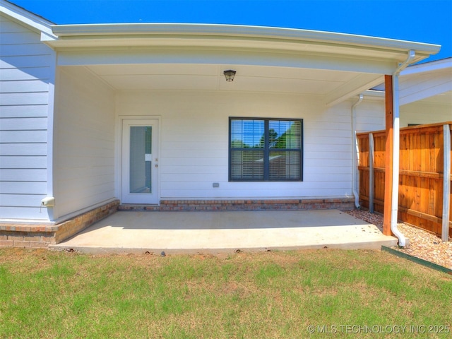 7809 S Redbud Ave, Broken Arrow, OK 74011 - view of exterior entry with a patio area