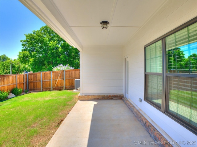 7809 S Redbud Ave, Broken Arrow, OK 74011 - fenced backyard with a patio