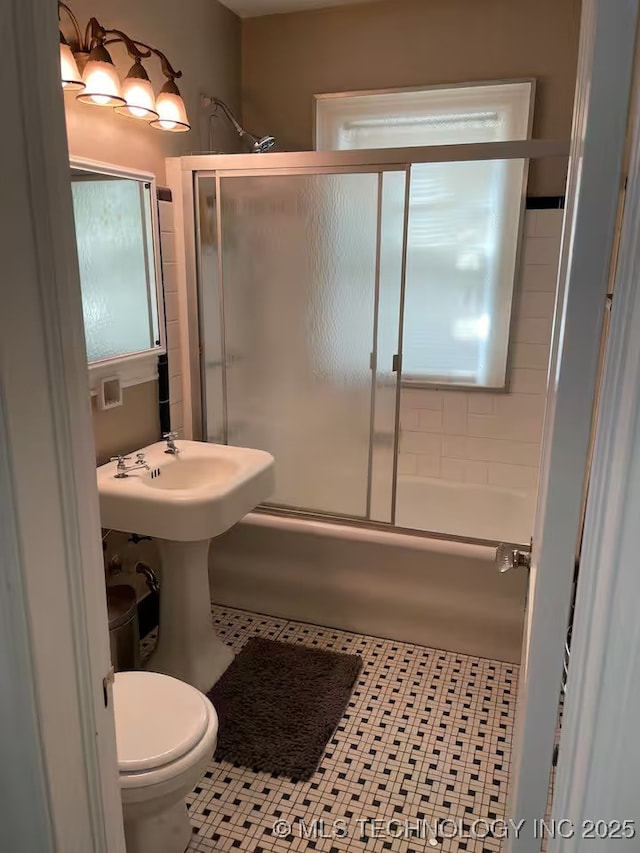 3156 S Madison Ave, Tulsa, OK 74105 - bathroom featuring combined bath / shower with glass door and tile patterned flooring