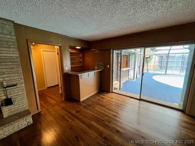 3707 Canton Ave, Tulsa, OK 74135 - kitchen with a textured ceiling and dark wood-style floors
