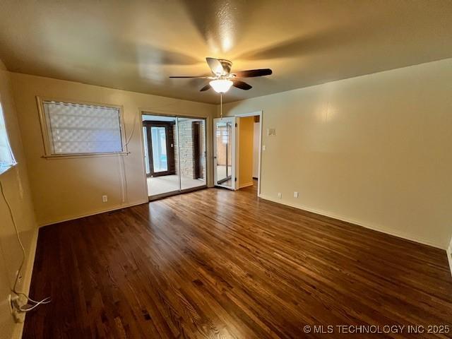 3707 Canton Ave, Tulsa, OK 74135 - unfurnished bedroom with dark wood-style flooring, access to exterior, and a ceiling fan