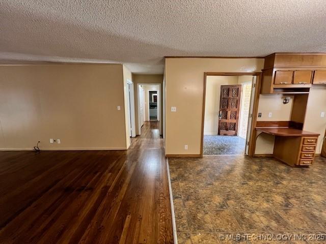 3707 Canton Ave, Tulsa, OK 74135 - kitchen with open floor plan, a textured ceiling, and dark wood finished floors
