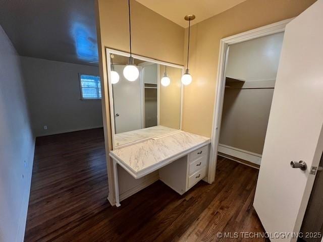 3707 Canton Ave, Tulsa, OK 74135 - bathroom featuring wood finished floors, vanity, and a walk in closet