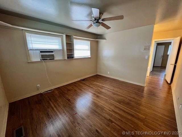 3707 Canton Ave, Tulsa, OK 74135 - spare room with cooling unit, ceiling fan, and wood finished floors