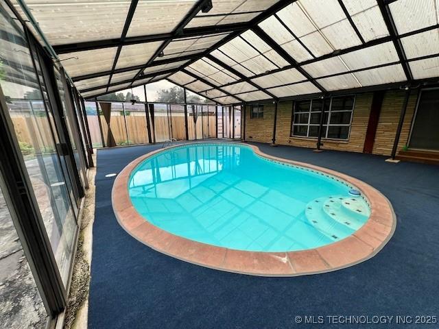 3707 Canton Ave, Tulsa, OK 74135 - outdoor pool with glass enclosure and a patio area