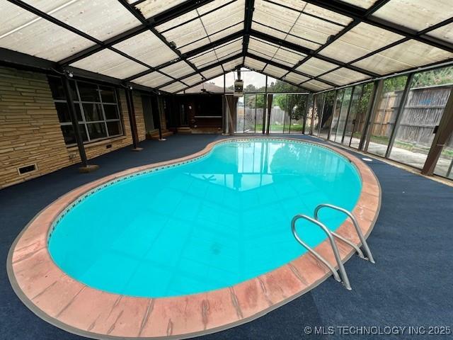 3707 Canton Ave, Tulsa, OK 74135 - view of pool with a pool, glass enclosure, and a patio