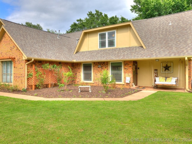 7001 S Redbud Ave, Broken Arrow, OK 74011 - view of front of house featuring roof with shingles, brick siding, and a front lawn
