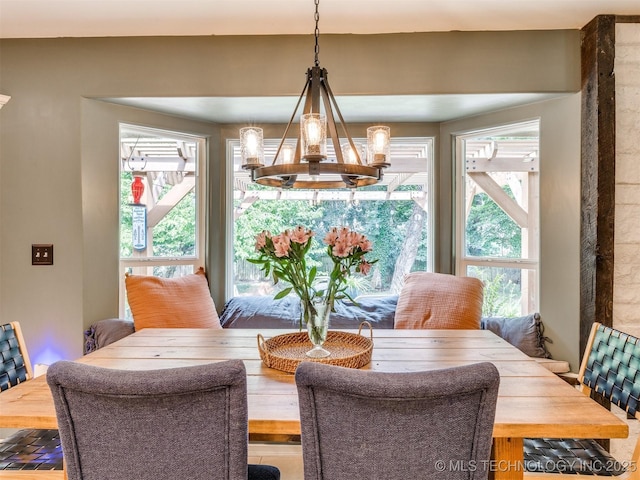 7001 S Redbud Ave, Broken Arrow, OK 74011 - dining area with healthy amount of natural light and a chandelier