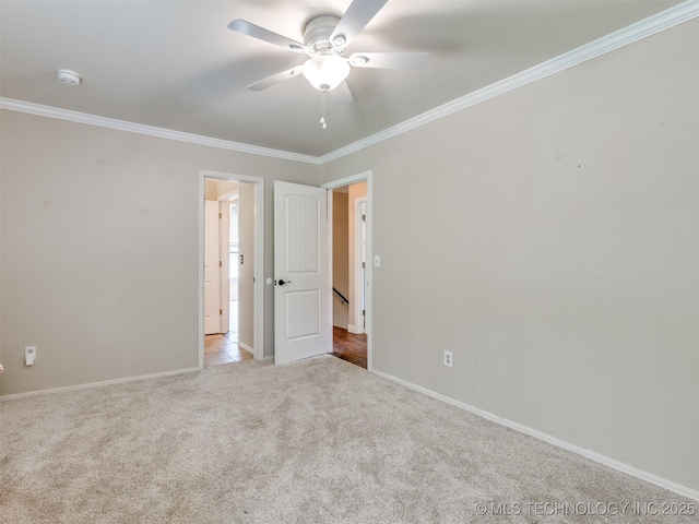 7001 S Redbud Ave, Broken Arrow, OK 74011 - spare room with a smoke detector, crown molding, a ceiling fan, and carpet
