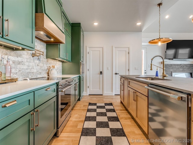 409340 E 1190th Rd, Eufaula, OK 74432 - kitchen with appliances with stainless steel finishes, green cabinets, decorative backsplash, pendant lighting, and recessed lighting