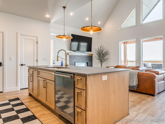 409340 E 1190th Rd, Eufaula, OK 74432 - kitchen with open floor plan, stainless steel dishwasher, light wood-type flooring, an island with sink, and hanging light fixtures