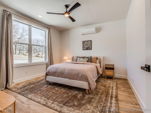 409340 E 1190th Rd, Eufaula, OK 74432 - bedroom featuring a wall unit AC, light wood-style floors, and multiple windows