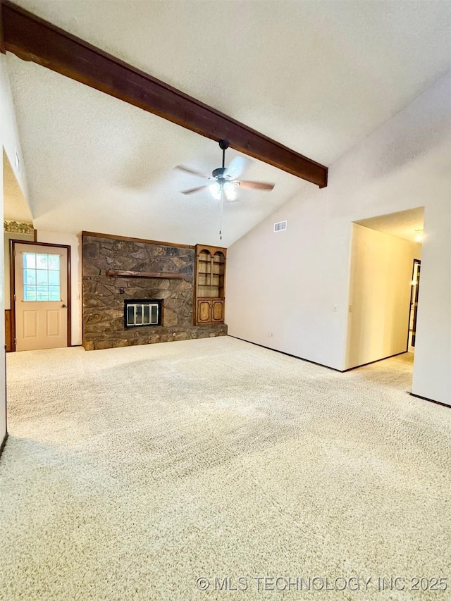9613 N 107th E Ave, Owasso, OK 74055 - unfurnished living room with carpet flooring, beam ceiling, ceiling fan, a fireplace, and high vaulted ceiling