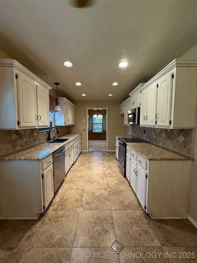 9613 N 107th E Ave, Owasso, OK 74055 - kitchen featuring appliances with stainless steel finishes, decorative backsplash, recessed lighting, and healthy amount of natural light