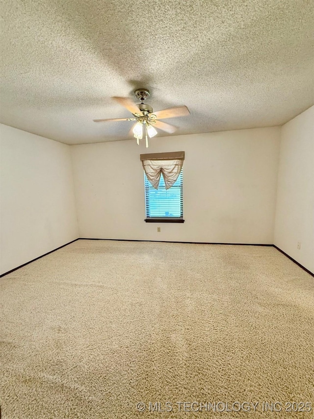 9613 N 107th E Ave, Owasso, OK 74055 - spare room with carpet, ceiling fan, and a textured ceiling