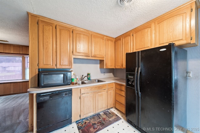 166 S 91st E Ave, Tulsa, OK 74112 - kitchen with black appliances, a textured ceiling, light flooring, and light countertops