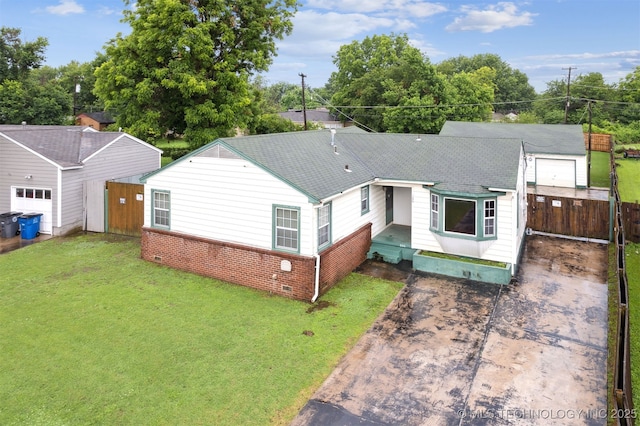 166 S 91st E Ave, Tulsa, OK 74112 - view of front of property with a shingled roof, brick siding, and concrete driveway